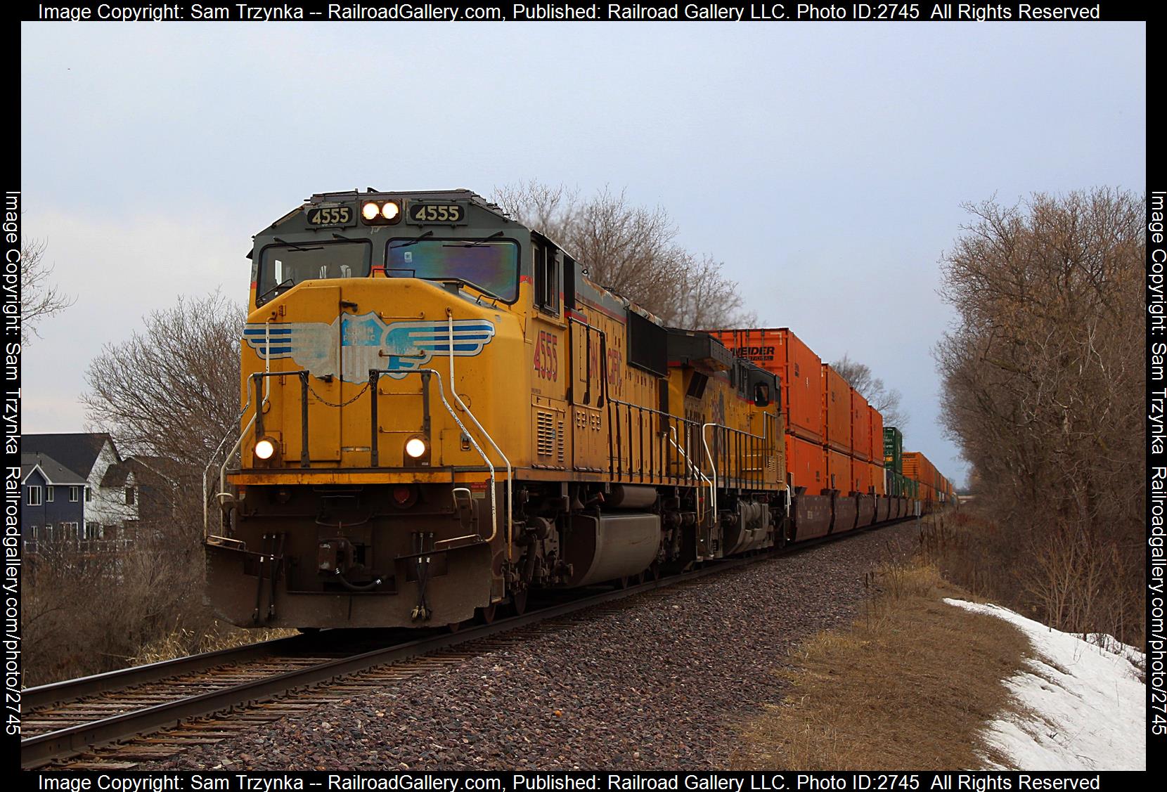 UP 4555 is a class EMD SD70M and  is pictured in Rosemount, Minnesota, USA.  This was taken along the UP Albert Lea Subdivision on the Union Pacific Railroad. Photo Copyright: Sam Trzynka uploaded to Railroad Gallery on 12/20/2023. This photograph of UP 4555 was taken on Sunday, April 09, 2023. All Rights Reserved. 