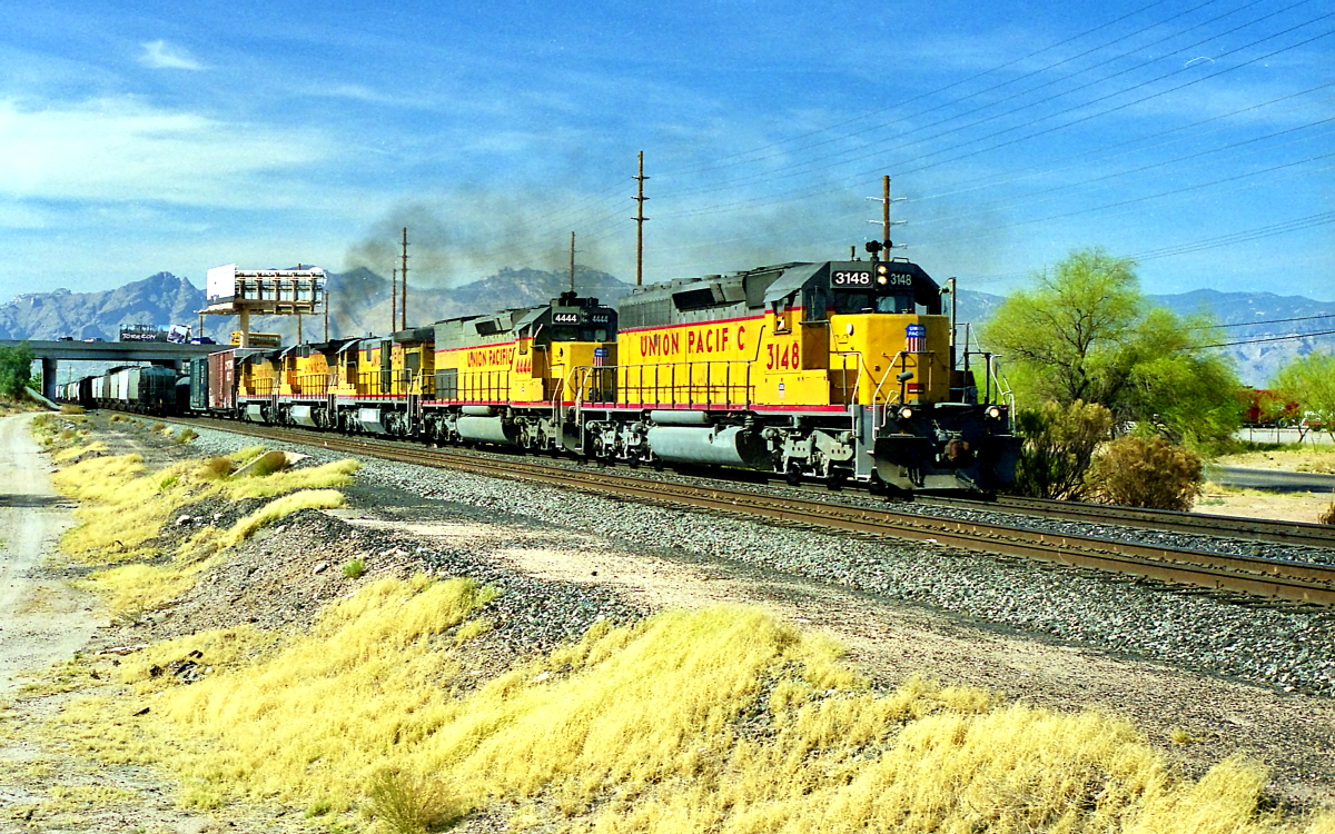 UP 3148 is a class EMD SD40-2 and  is pictured in Tucson, Arizona, USA.  This was taken along the Lordsburg/UP on the Union Pacific Railroad. Photo Copyright: Rick Doughty uploaded to Railroad Gallery on 02/10/2024. This photograph of UP 3148 was taken on Monday, May 08, 2000. All Rights Reserved. 